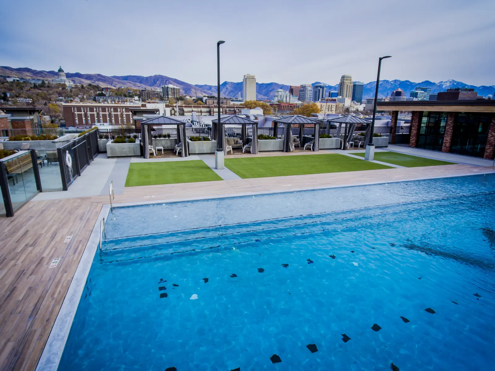 Overhead drone shot of the Olympic pool and rooftop deck geometry
