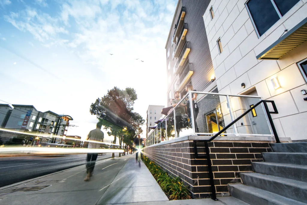 Encore mixed-use residential building and streetscape at sunset