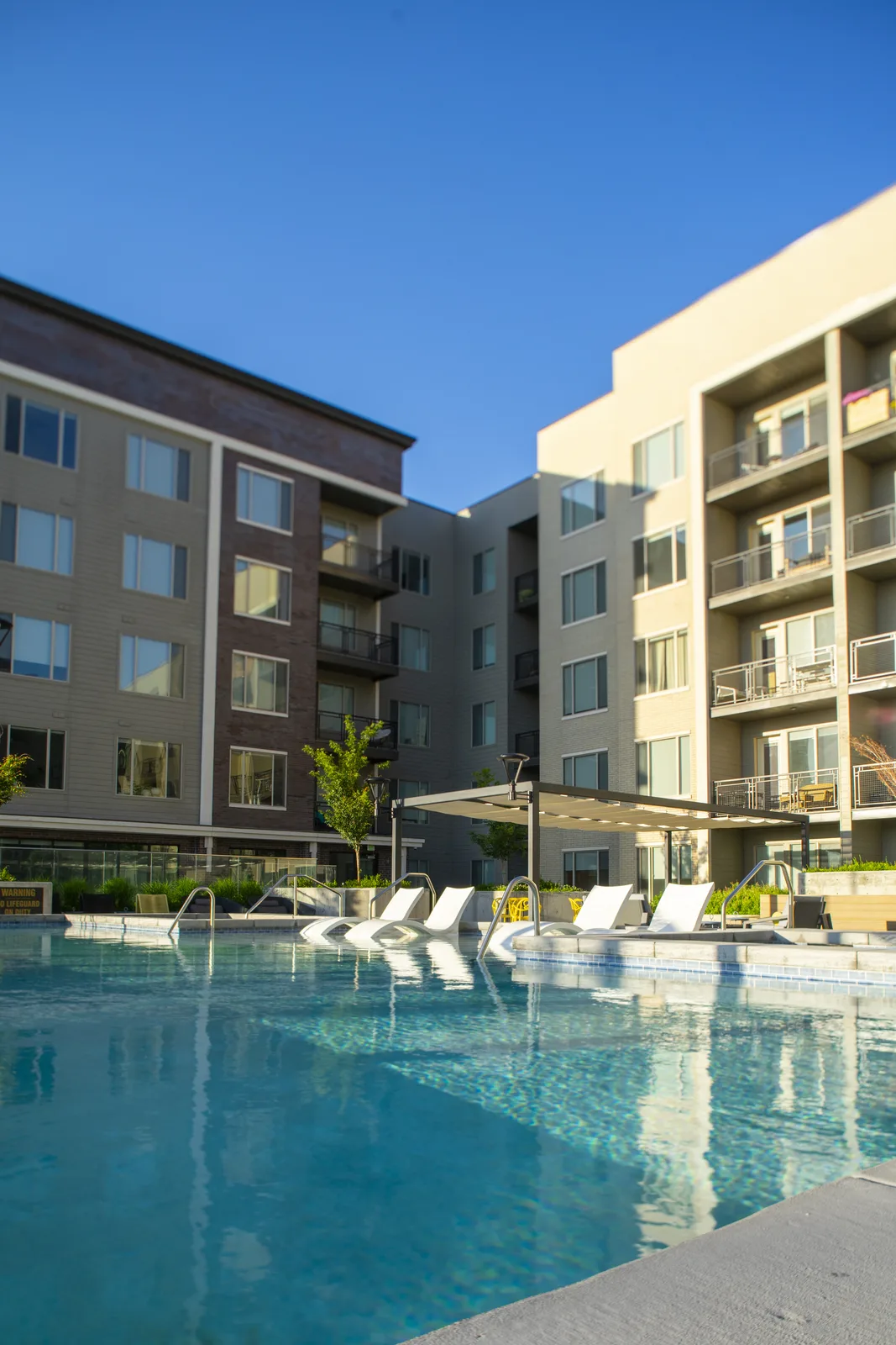 Park Avenue pool deck lounge chairs and amenity terrace by day