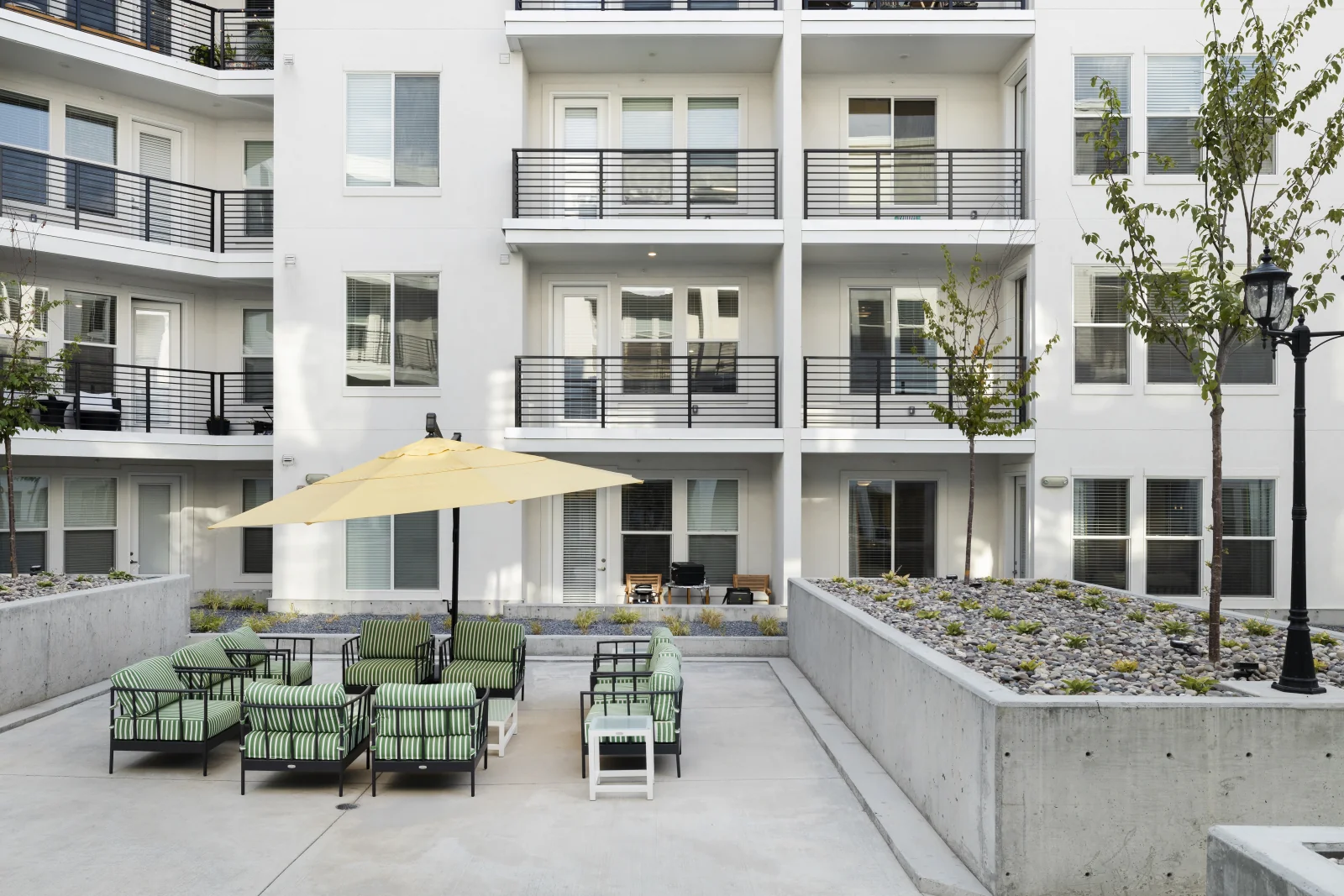 Podium courtyard umbrella lounge with the balconies above