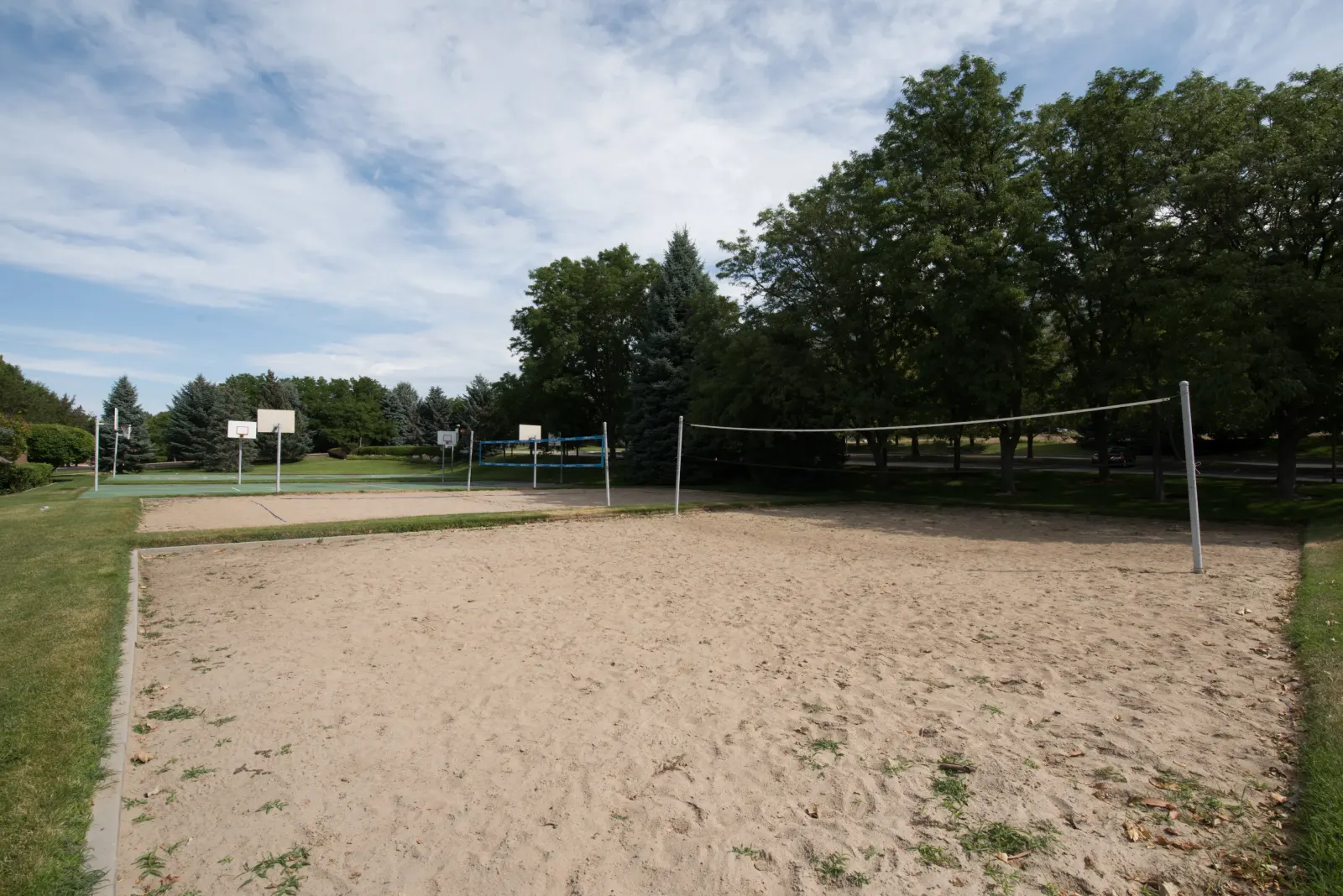 STAND-IN BRANDON TO VET — The Yard BEFORE: empty sport-court / volleyball-pit state (July 2018 master)